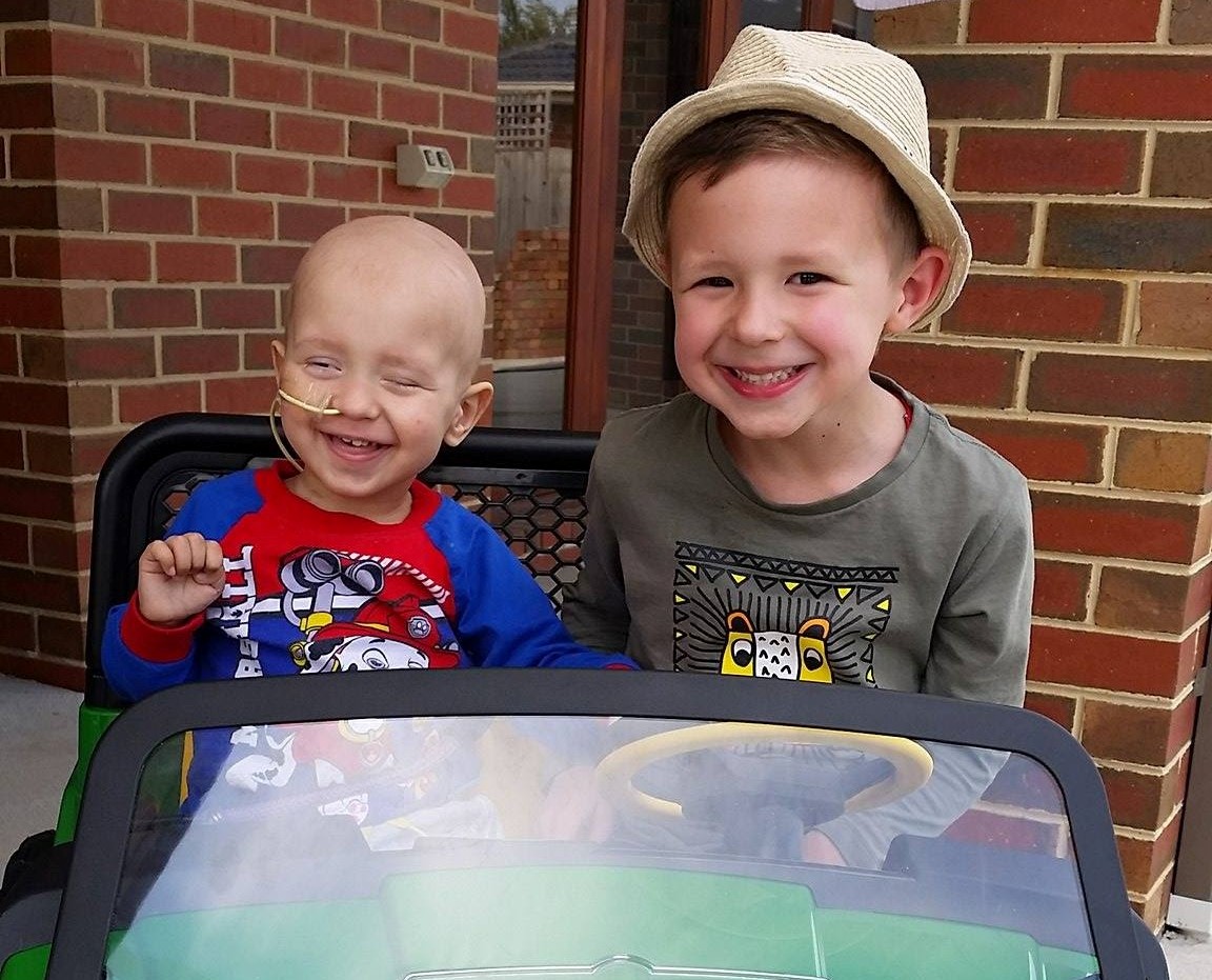 Two brothers in toy car