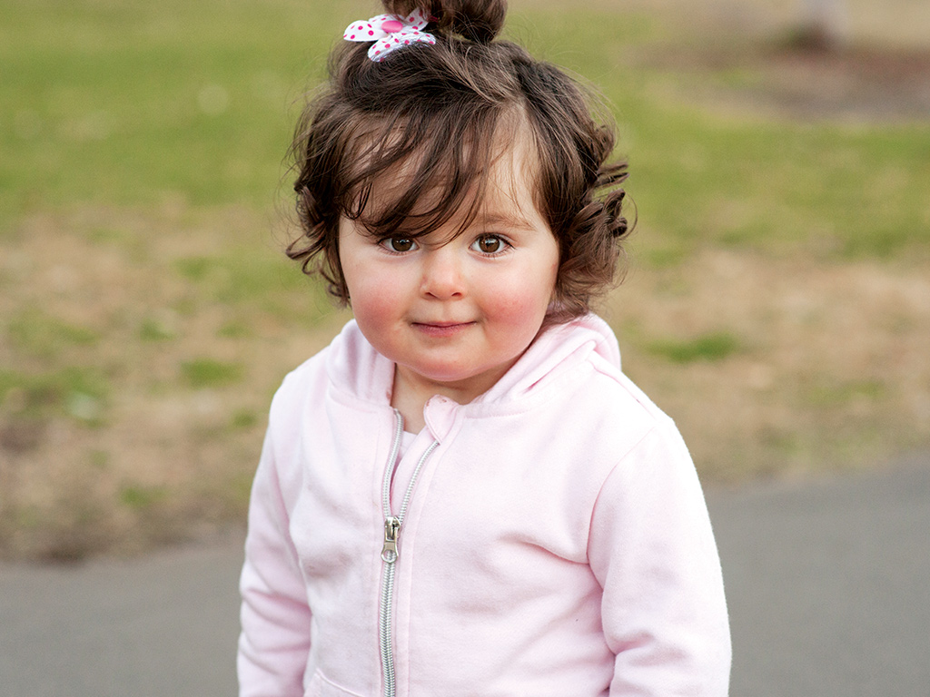 young girl smiling at the camera