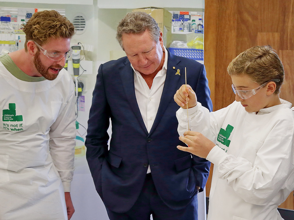 Andrew Forrest in laboratory with young boy